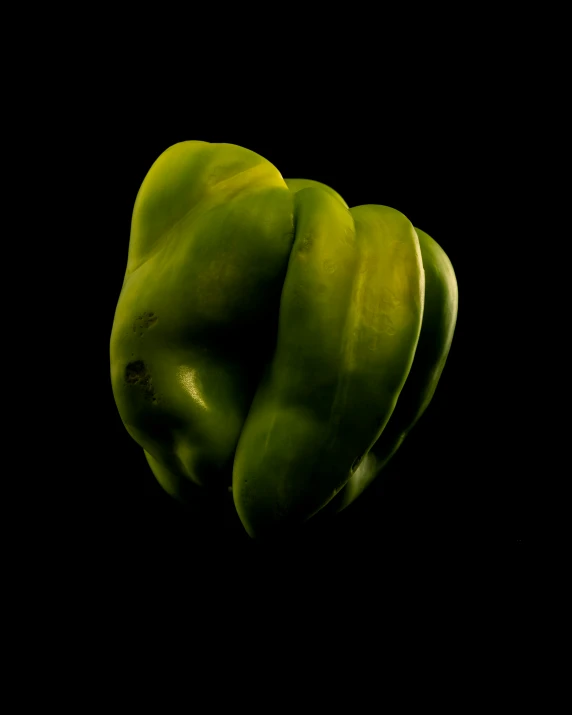 a close up view of two green peppers