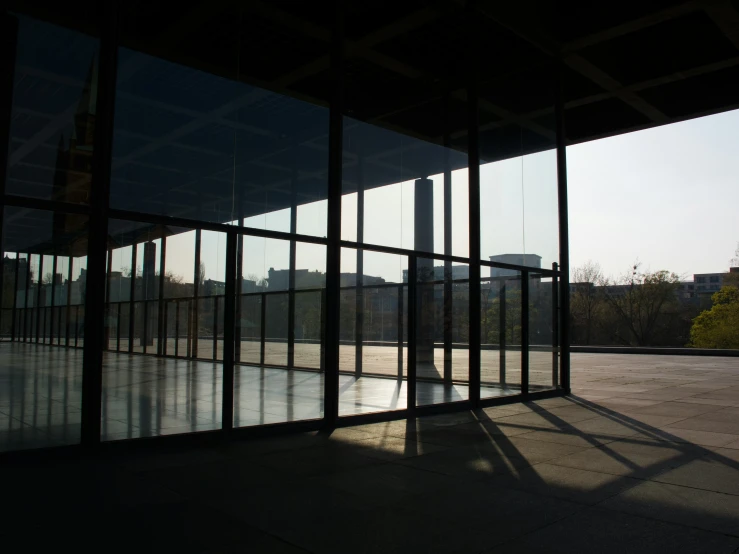 a view of the outside of a building through some glass doors