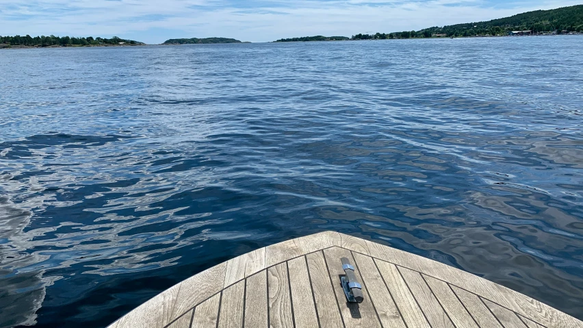 the water is choppy and the wooden deck is straight ahead