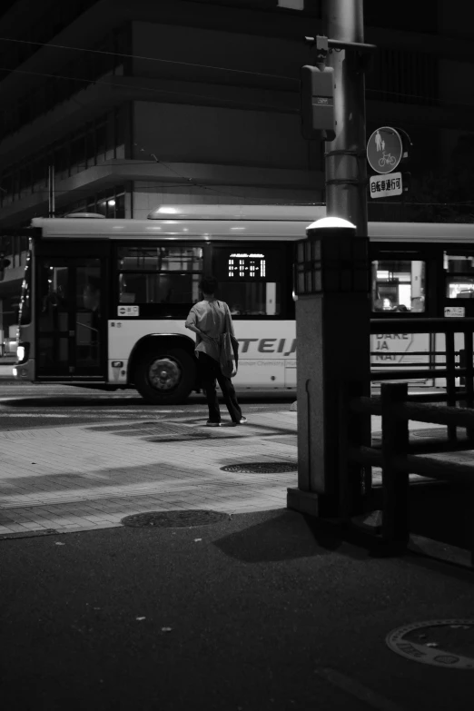 there is a bus parked near a street light