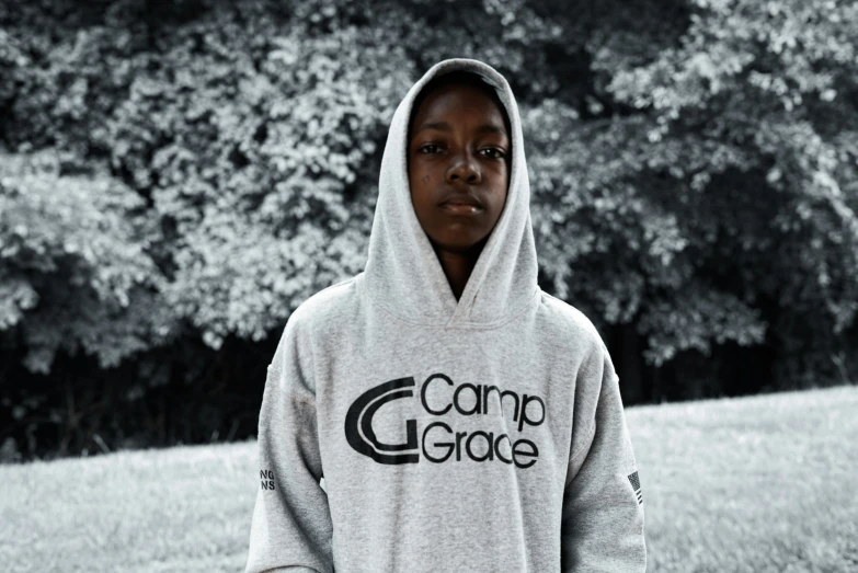 a young man in a hoodie that reads camp glazee