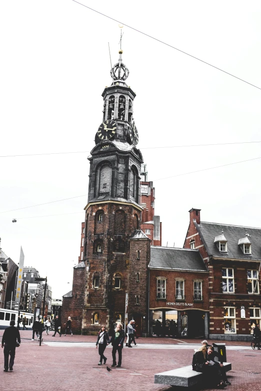 a tall tower sitting on the top of a brick building