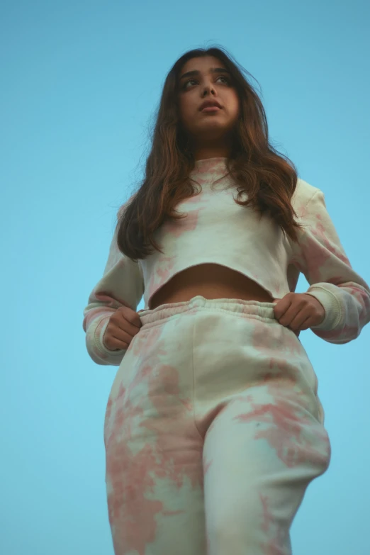 woman wearing pink tie dye suit with hoodie