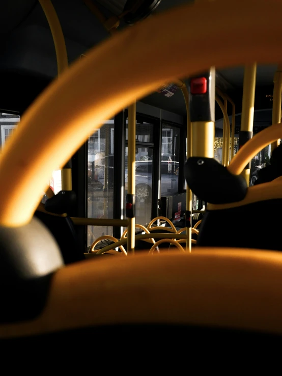 inside view of public transportation with seats and railings