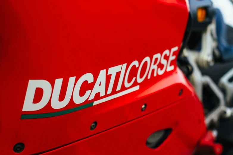 the word ducati on a motorcycle is white