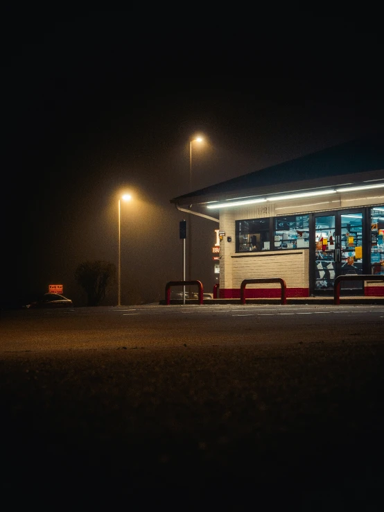 the empty bus station is lit up for the night