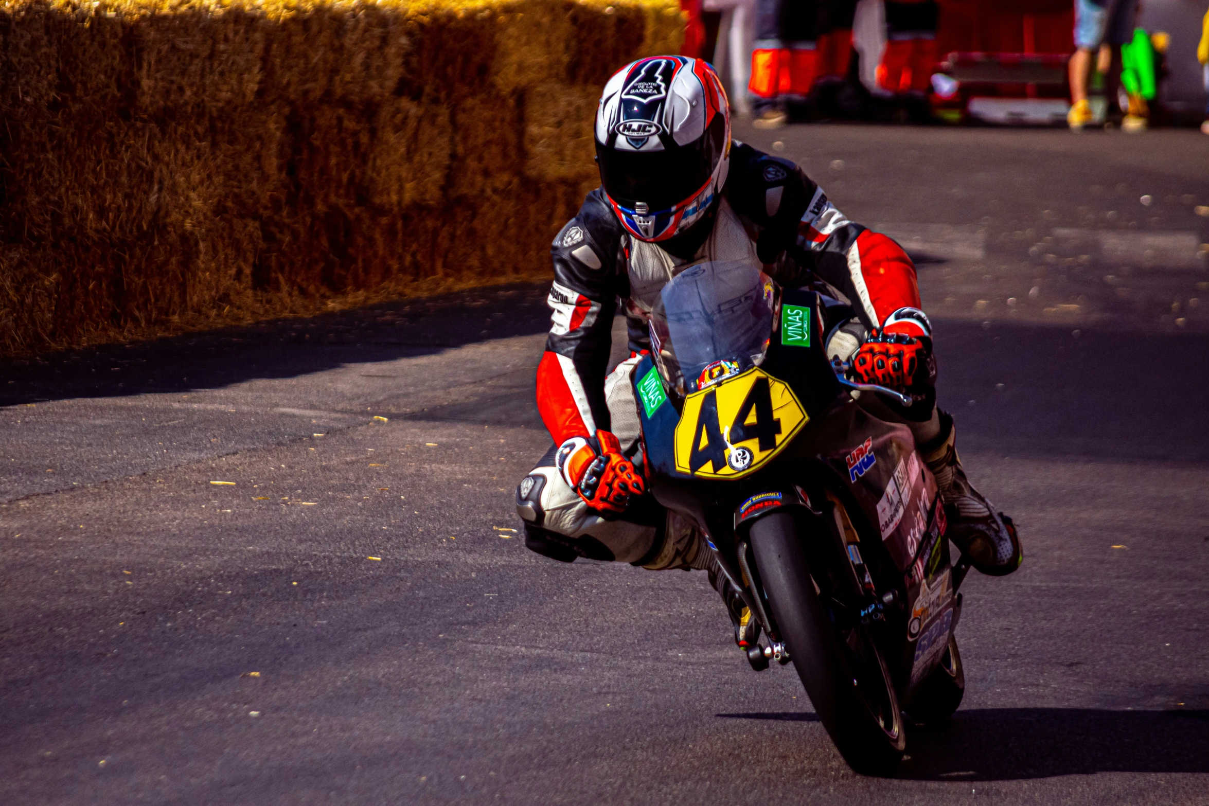 a person is racing on a motorcycle down the street