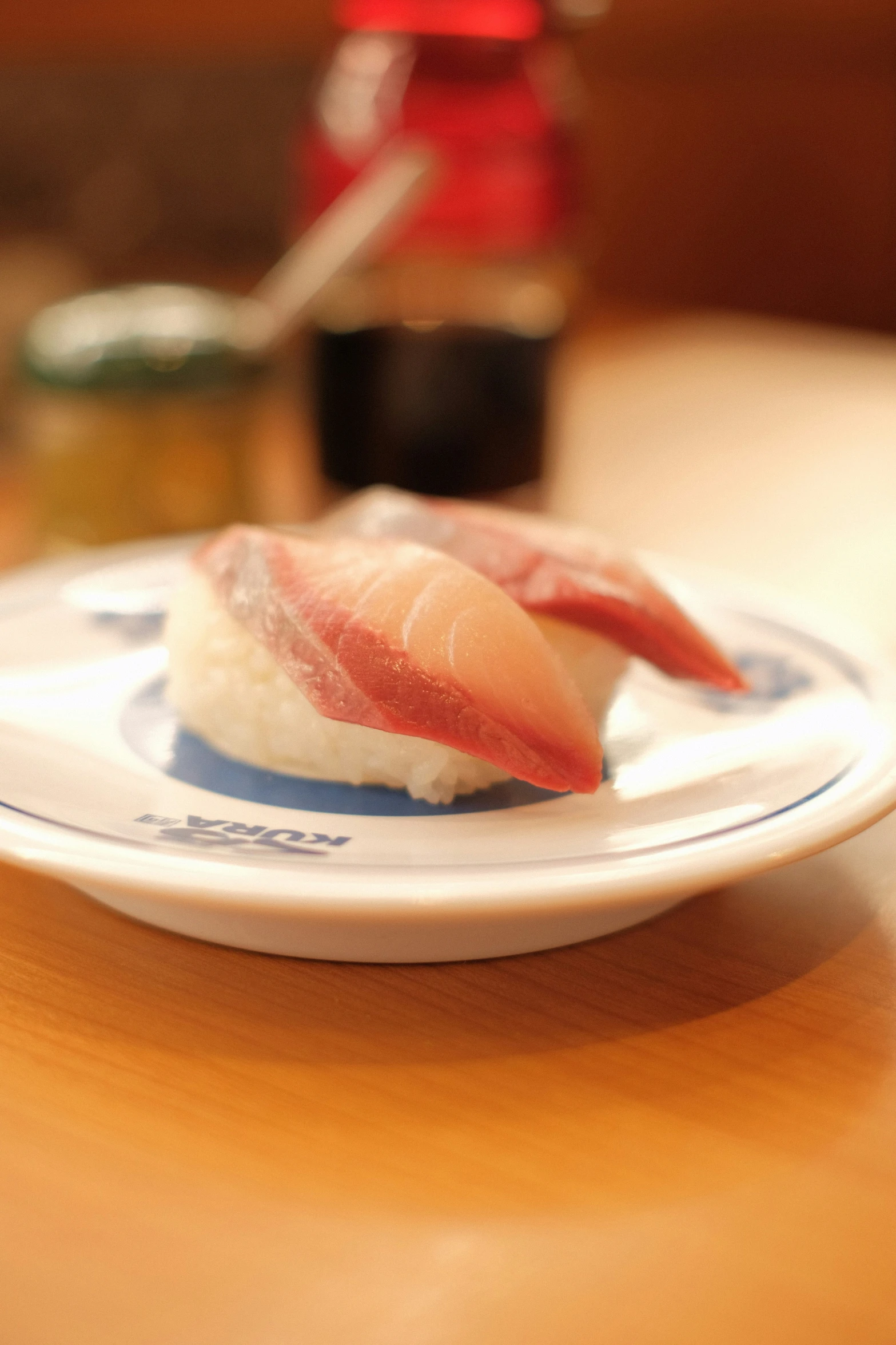 a small sushi plate with pieces of tuna on it