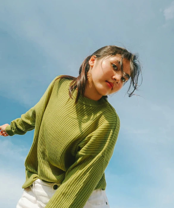 an image of a woman wearing a sweater