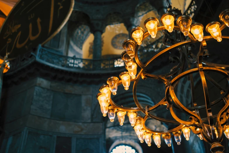 an elegant chandelier is lit up by glowing bulbs