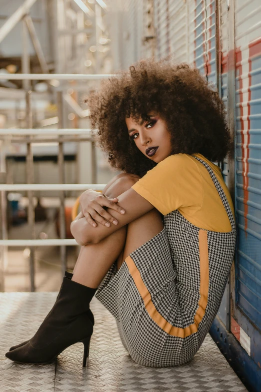 a young woman is posing on the steps