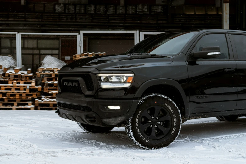 a ram is shown parked on a snowy day