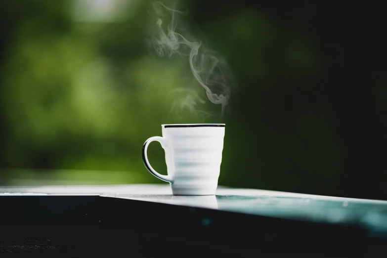 steaming coffee is over the outside table