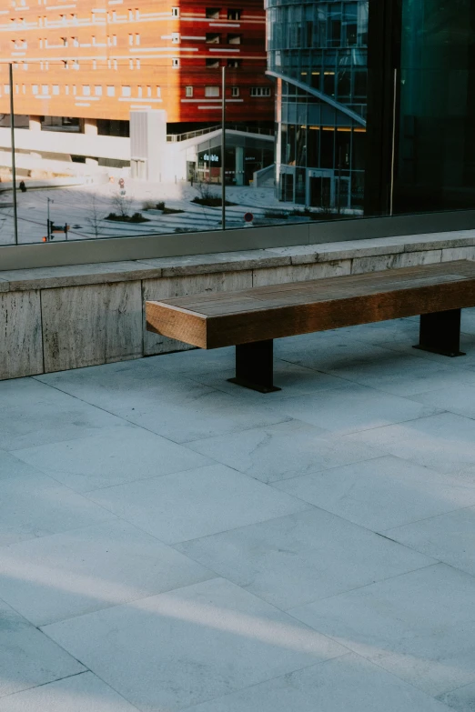 there is a wooden bench that is outside