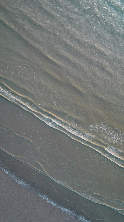 the top of a boat on the beach at dusk