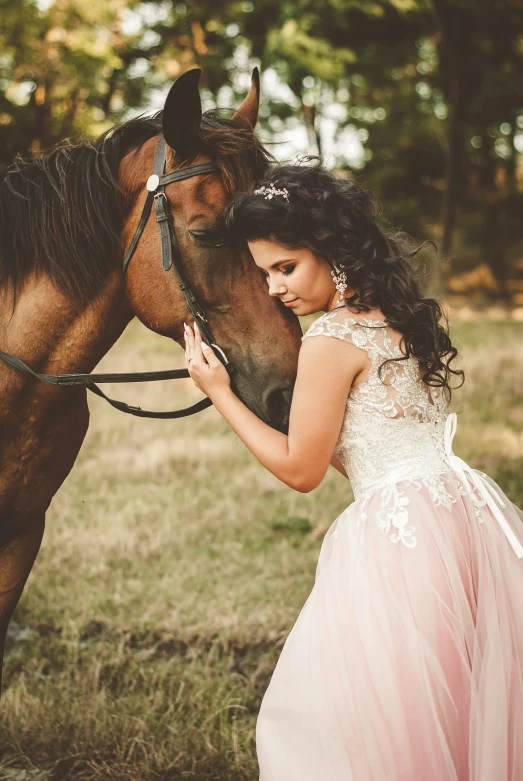 a bride and groom are standing next to their horse