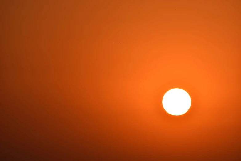 a close up of a bright orange sun