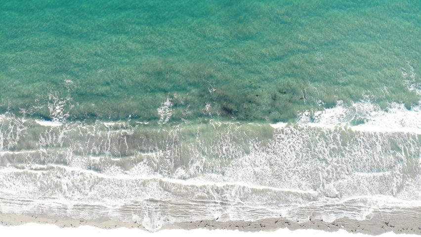 an aerial s of green water in the ocean