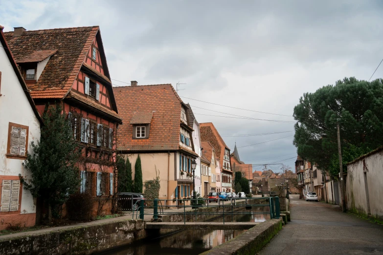 old houses along a canal in the middle of town