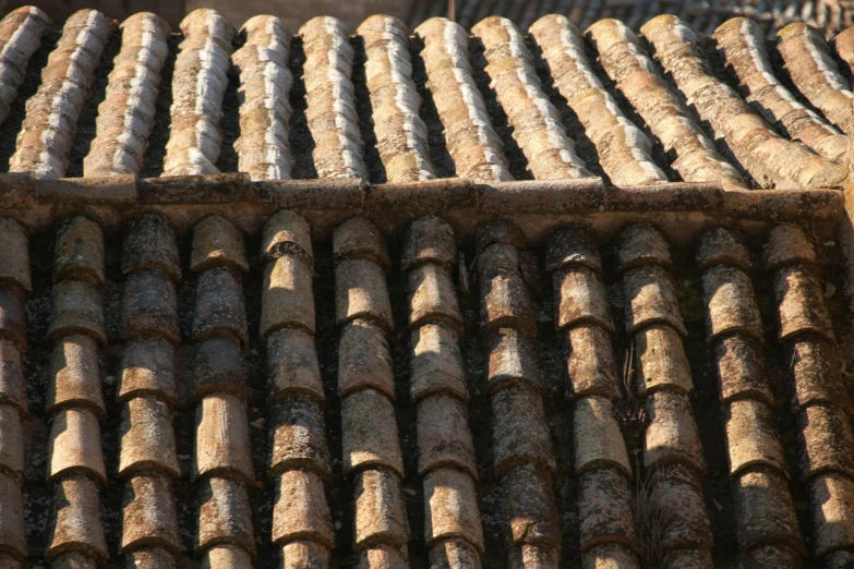 a roof top with tiled roofs of various sizes