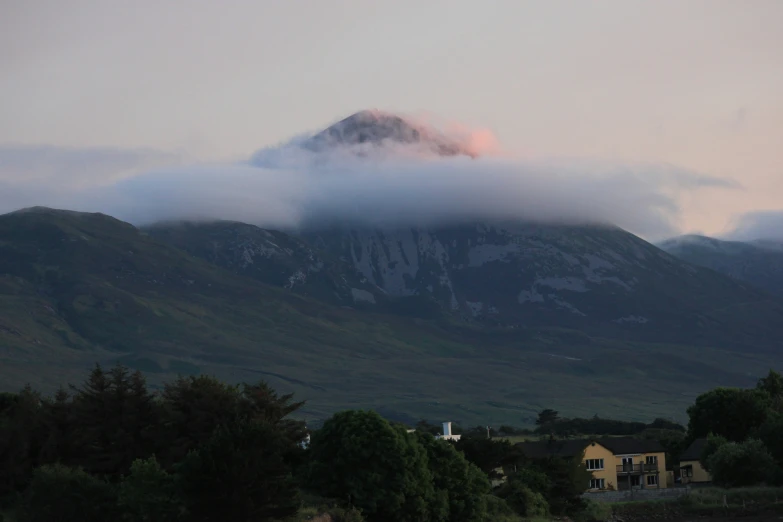 a mountain with houses in front of it