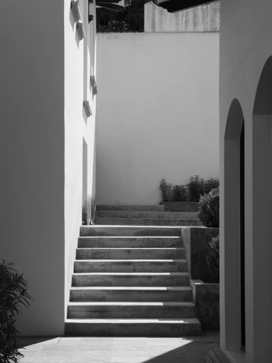 black and white po of stairs leading to the next set of stairs
