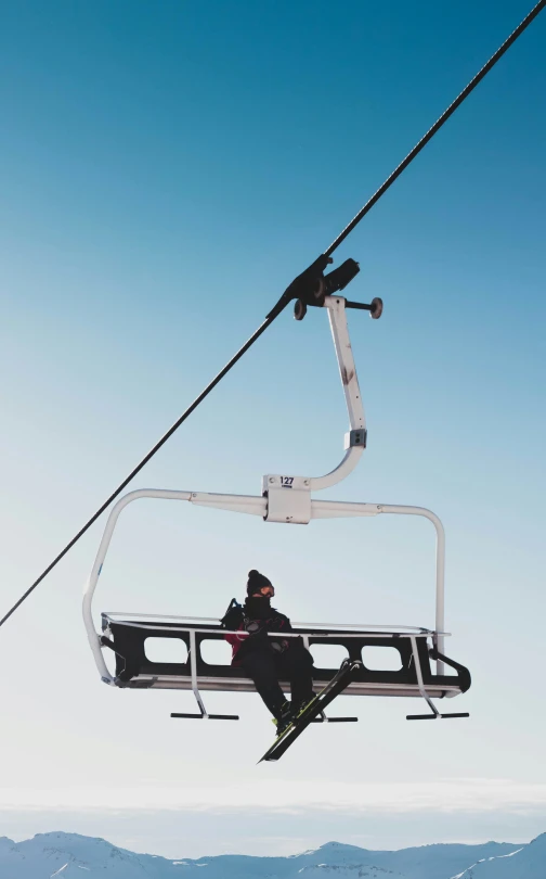 a person skiing down the ski lift