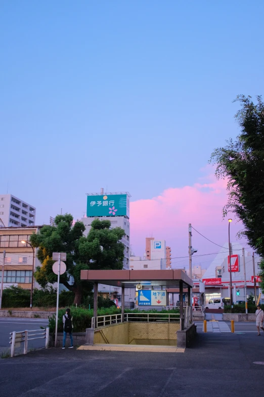 a parking lot with an overpass in the background