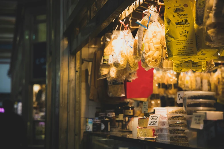 some bags of food hanging on the side of the wall