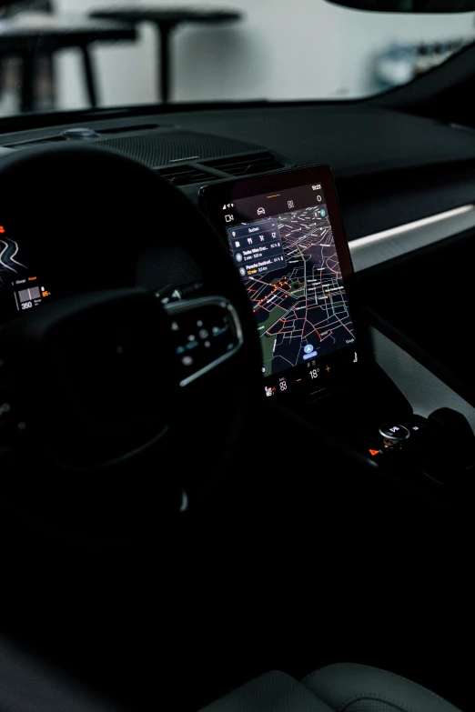 a car dashboard is shown with a gps app on the display