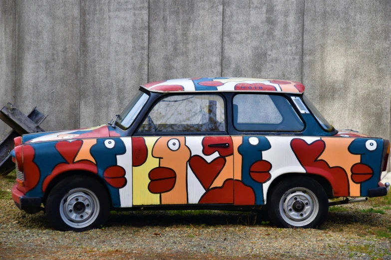 an old painted car that looks like it is painted