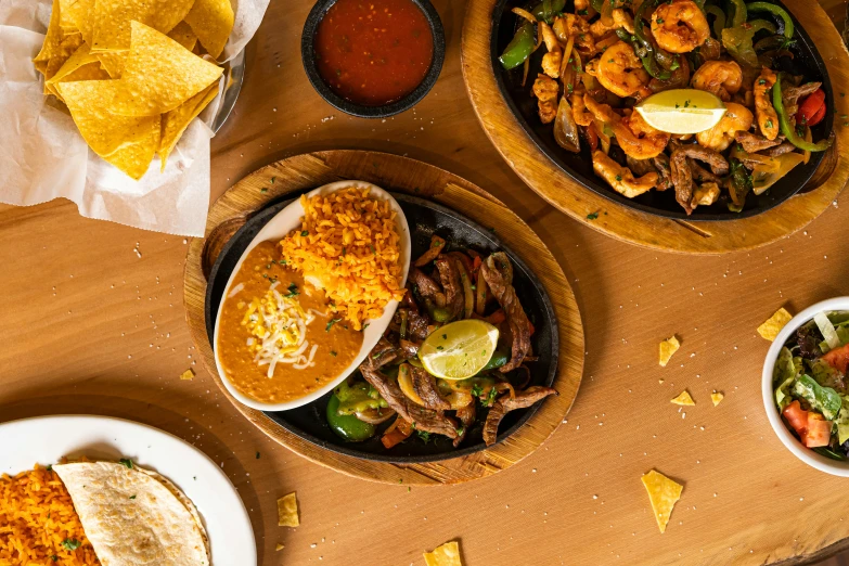 various plates filled with tacos, tortillas and mexican food