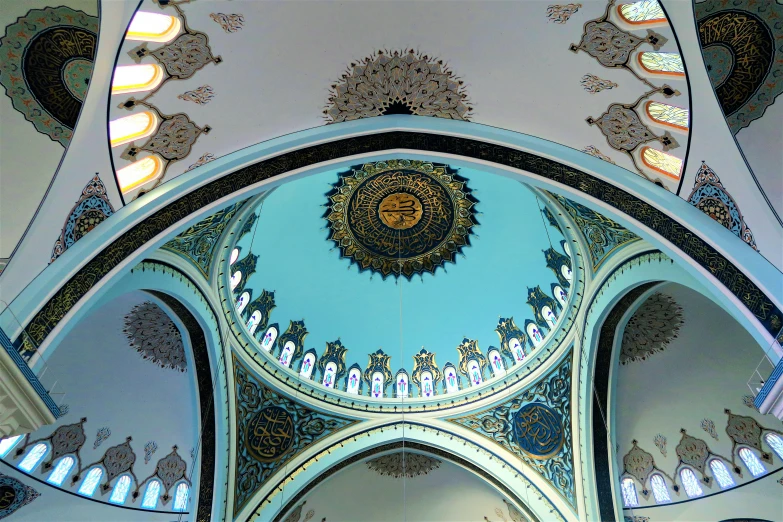 the inside of a building with an intricate painted ceiling