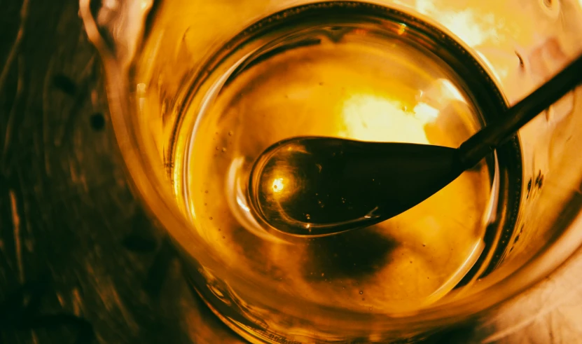 spoon in a glass with ice and water inside