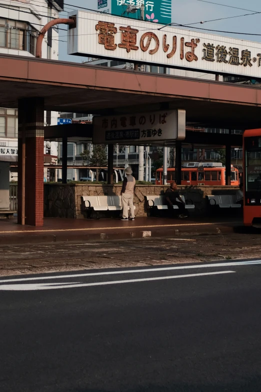 a bus sits at the entrance to a shopping center