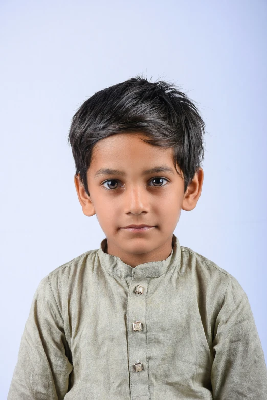 an indian child poses for the camera