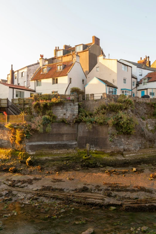 several building on a small hill over looking the water