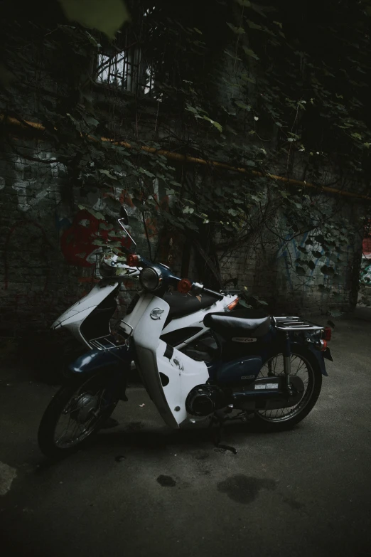 this motorcycle is sitting in the street at night