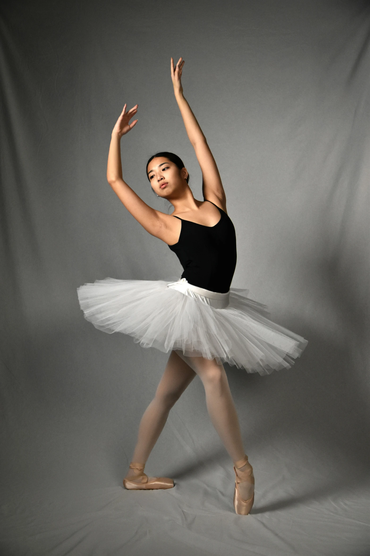 young ballerina in black and white tutu skirt