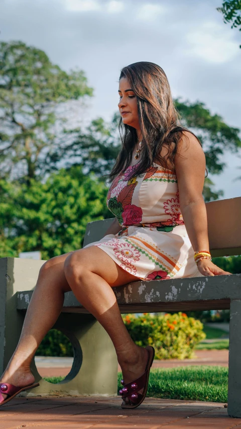 a woman wearing sandals sitting on a bench