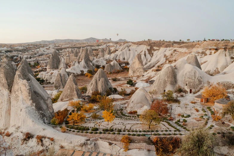 an aerial s shows a hilly landscape covered in rocks