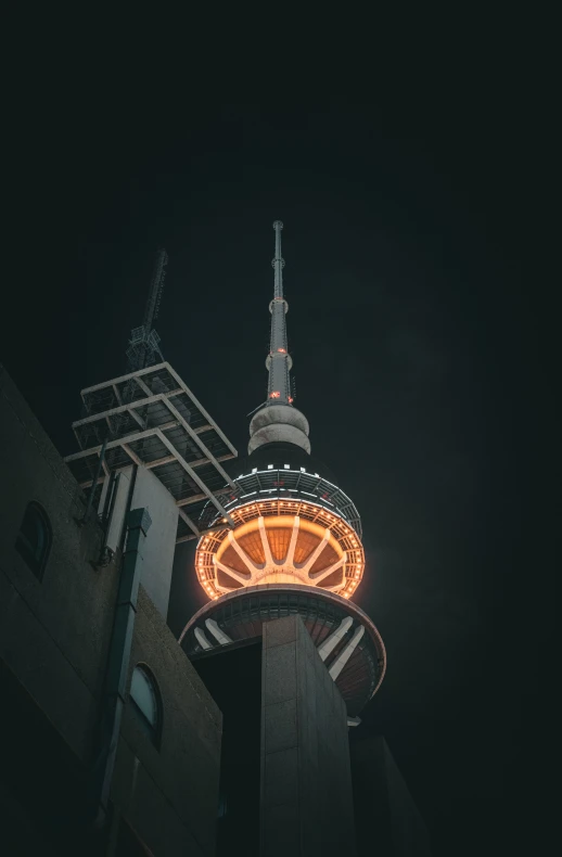 a view of the spire and building lit up at night