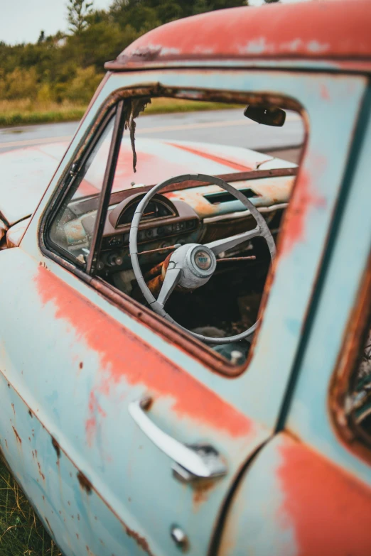 the interior of an old rusty truck with rust paint