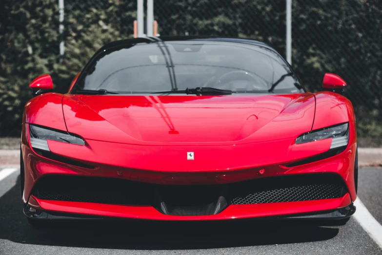 ferrari laferra on the parking lot of a car showroom