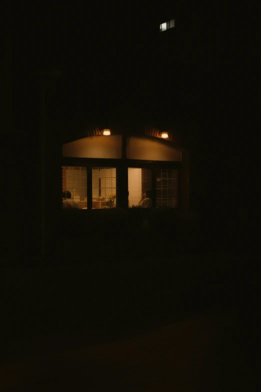 a house lit by street lights at night