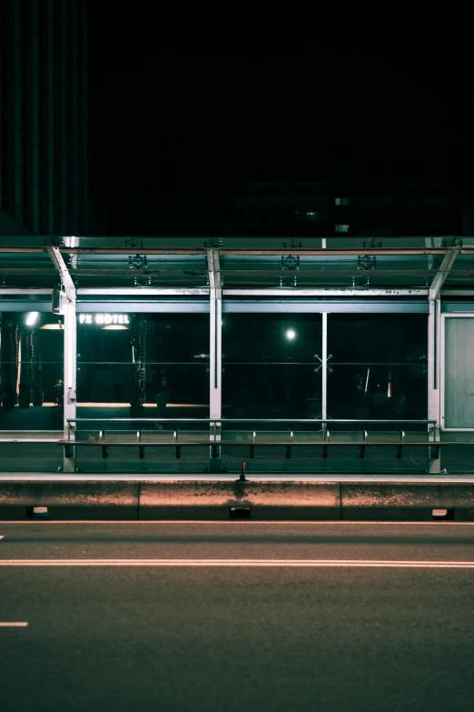 the bus stop is empty at night time
