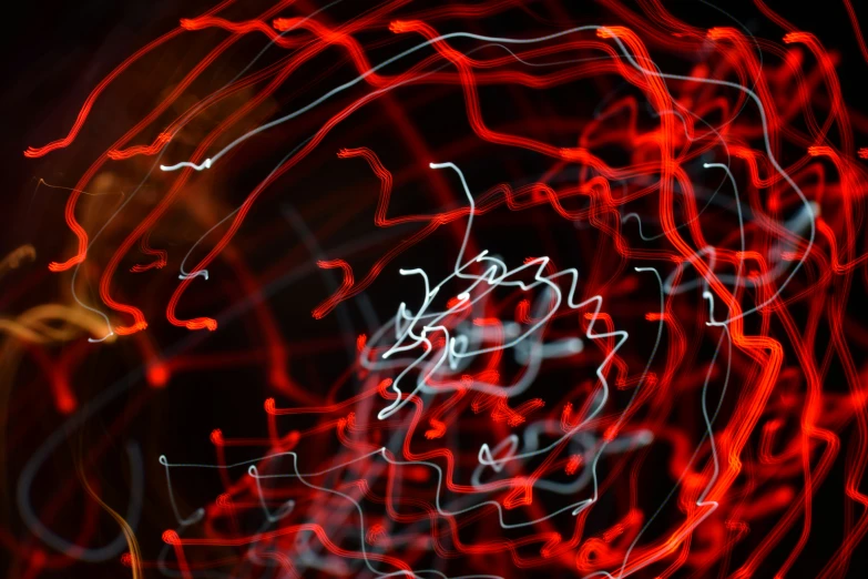 abstract image with streaks of red, white and blue lights