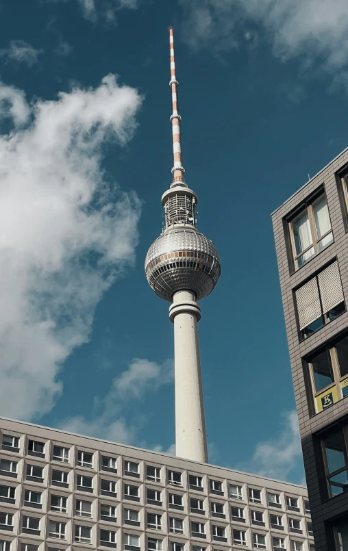 the view of a tall, slender tv tower in the city