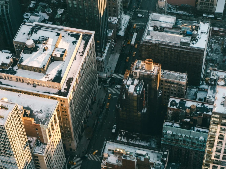 the city has snow on its roofs and rooftop tops