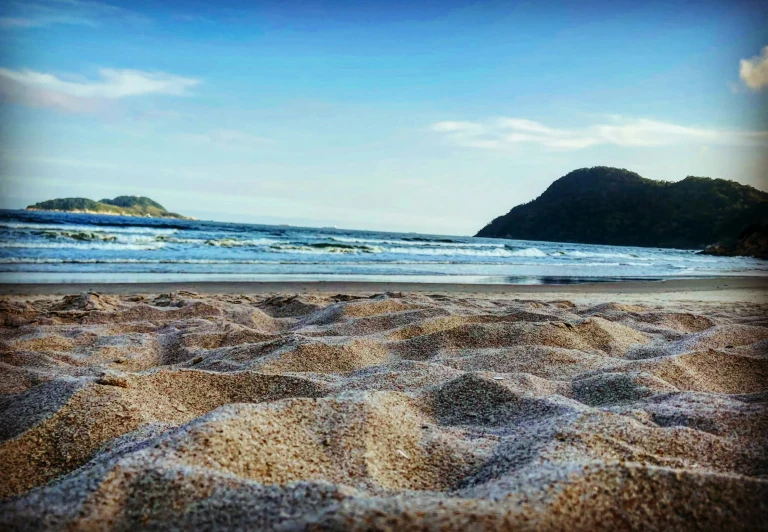 a sand pile that is on the beach